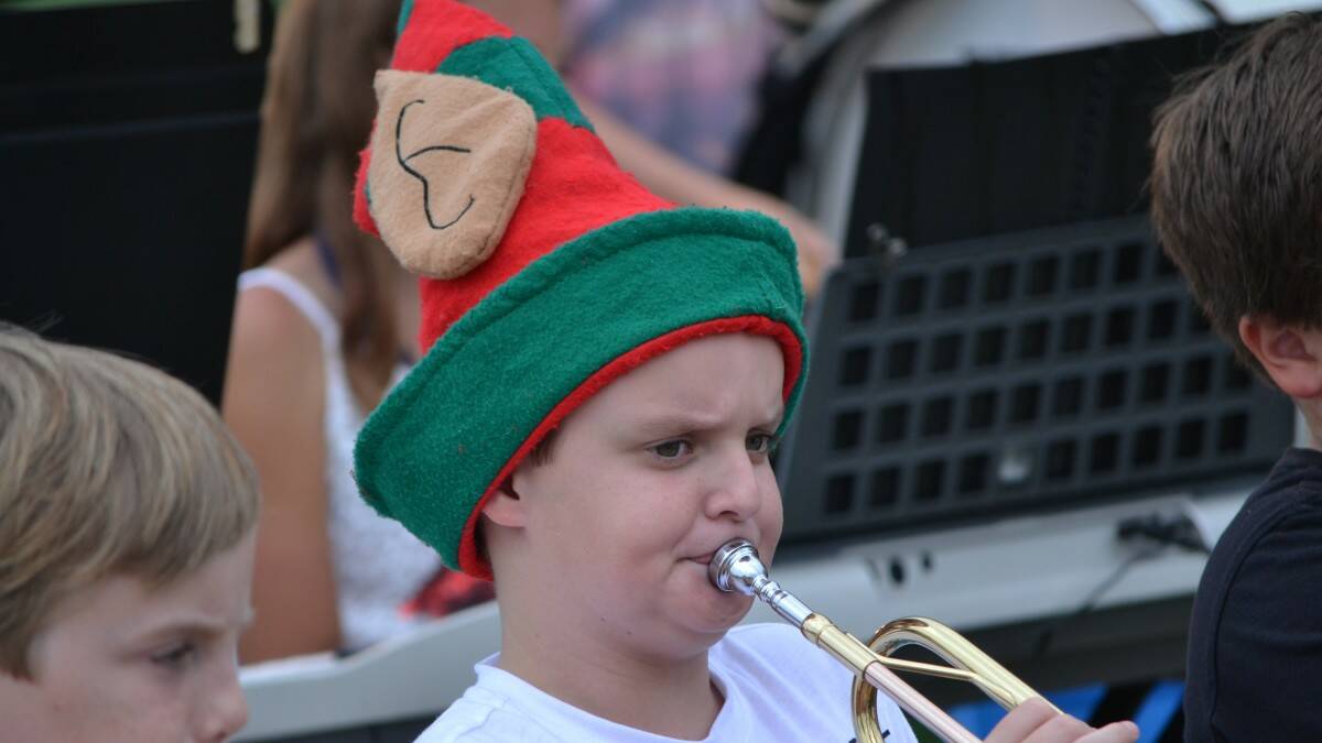 Lleyton Blackman playing trumpet in the North Haven Public School Band at Christmas Carols on the Deck at Wauchope Bonny Hills Surf Club. . Photo: The Camden Haven Courier.